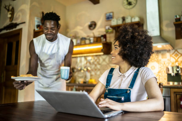 istock Caring boyfriend serving breakfast to his girlfriend 1267228572
