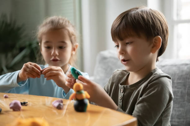 istock Happy cute small children siblings involved in handmade activity. 1267228687