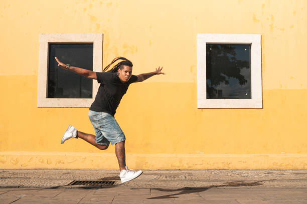 istock Ecstatic punk man jumping outdoors 1267230331