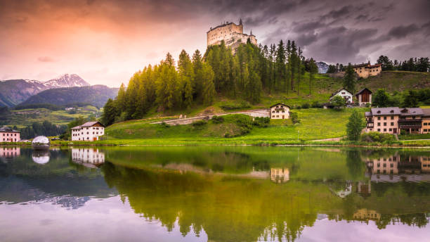 istock Majestic landscape – Idyllic Tarasp village and lake reflection between mountains, Engadine – Switzerland 1267237654