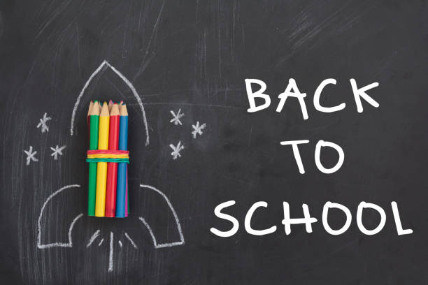 istock Rocket made from pencils on chalkboard with the text Back to School 1267239140
