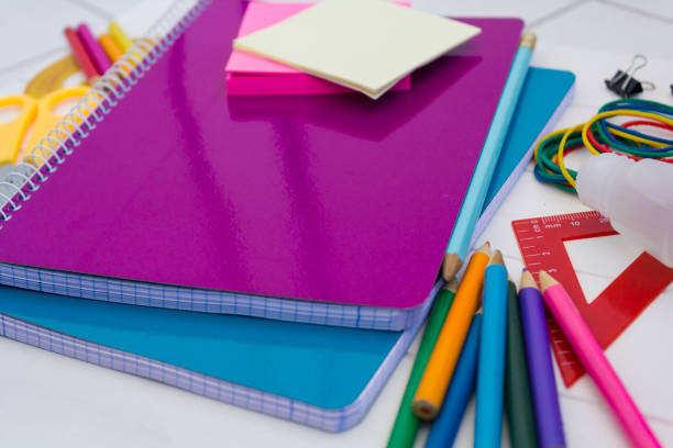 istock School supplies on white wooden table 1267239155
