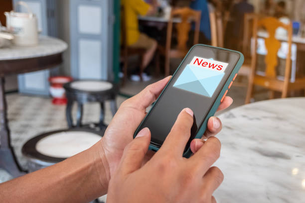 istock Woman hand using smartphone and it's show email recieve notification icon pop up on screen of mobile phone. Business communication  technology concept. 1267242294