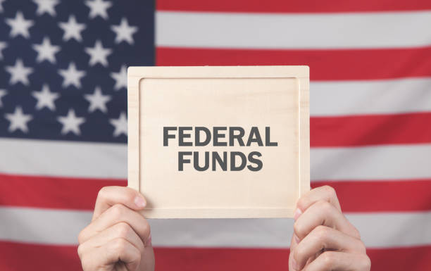 istock Male hands showing Federal Funds text. 1267249014