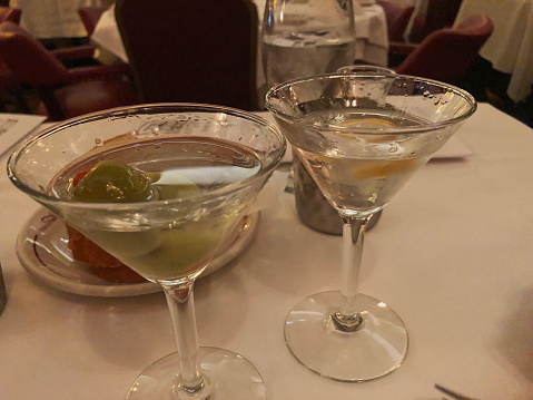 Two martinis at a dinner table in a restaurant