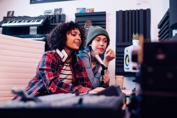 Two musicians cooperating in the music studio