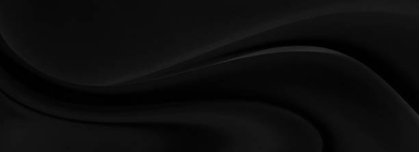 istock Black gray satin dark fabric texture luxurious shiny that is abstract silk cloth panorama background with patterns soft waves blur beautiful. 1267251734