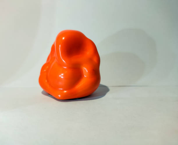 istock orange statue of god ganesh on a white isolated background 1267252648