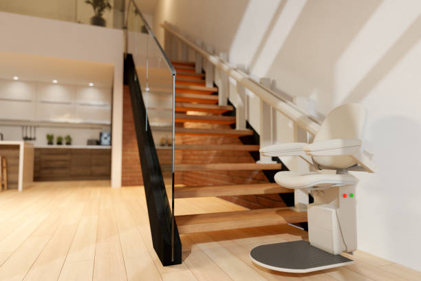 Automatic Stair Lift On Staircase Automatic Stair Lift On Staircase accessibility for persons with disabilities stock pictures, royalty-free photos & images
