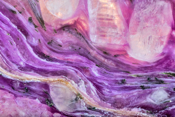 istock lilac color dark charoite stone structure 1267261894
