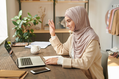 Muslim Woman Taking Part In Video Conference