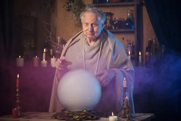elderly wizard  with crystal ball
