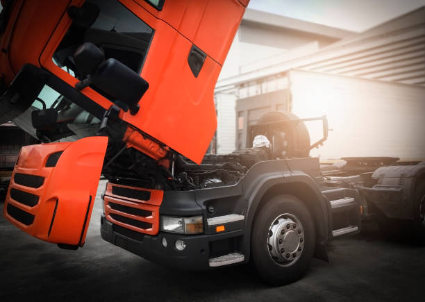 istock Semi tuck repairing and maintenance. opened truck engine waiting for a replacement. 1267263522