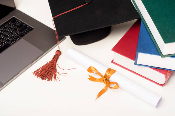 istock Graduation cap with laptop computer , Online education concept 1267263630