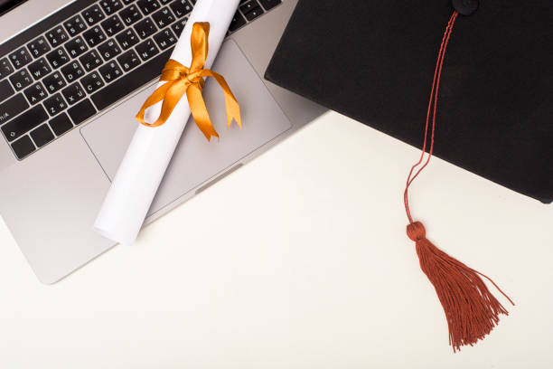 istock Graduation cap with laptop computer , Online education concept 1267263631
