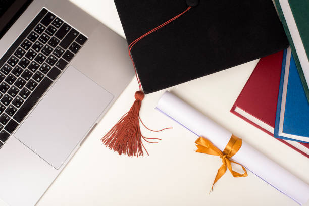 istock Graduation cap with laptop computer , Online education concept 1267263637