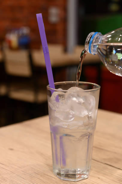 istock A glass of water on a blurred restaurant background 1267264313