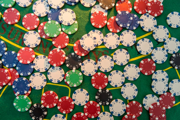 istock Casino gambling chips on green table. All for game. 1267269175