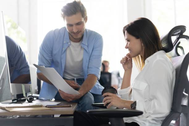 istock Coworkers team in modern office. Project managers work new idea. Young business crew working with startup studio 1267269413