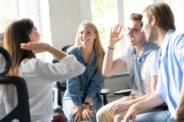 istock Happy business team making high five with their hands in the office. 1267270929