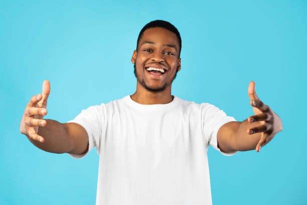 istock Black Guy Stretching Hands For A Hug Over Blue Background 1267273294