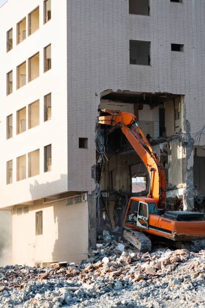 istock Construction machinery is demolishing the house 1267274738