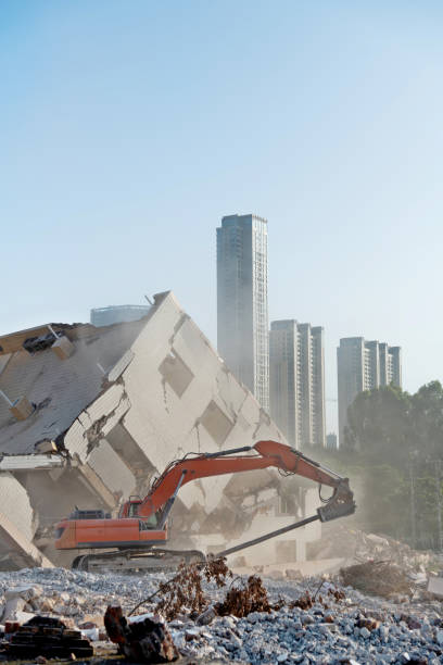 istock Construction machinery is demolishing the house 1267276213