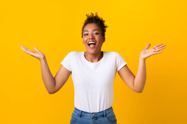 istock Happy young girl raising hands up at studio 1267277309
