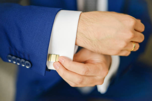 istock Groom or businessman fasten cufflink 1267277514