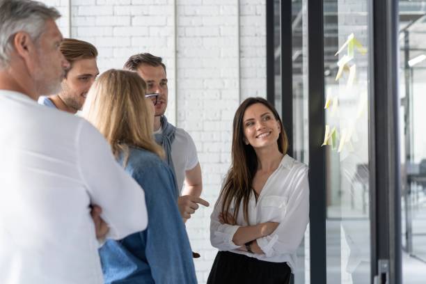 istock Business people meeting at office and use post it notes to share idea. Brainstorming concept. Sticky note on glass wall 1267277989
