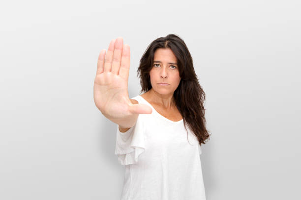 istock Attractive Spanish middle-aged brunette woman making expressive gestures. Stop it. Stop. 1267278766