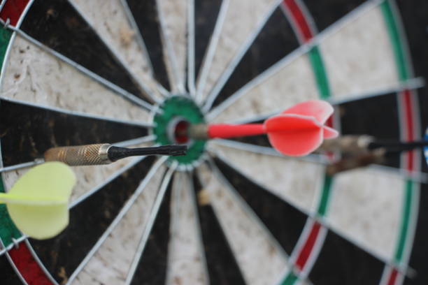 istock Darts target closeup. Success hitting target aim goal achievement concept 1267279818