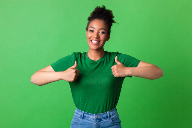 istock Afro lady showing thumb up and smiling 1267280374
