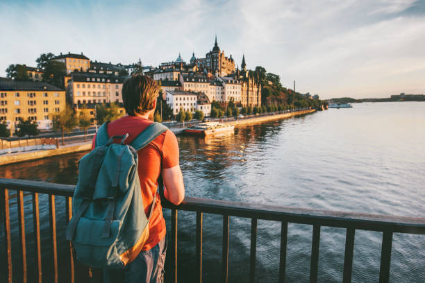 tourist man sightseeing stockholm city enjoying view traveling lifestyle summer vacations in sweden - stockholm imagens e fotografias de stock