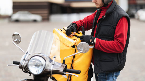 istock Unrecognizable Courier Opening Delivery Backpack With Food Outdoors, Cropped, Panorama 1267282604