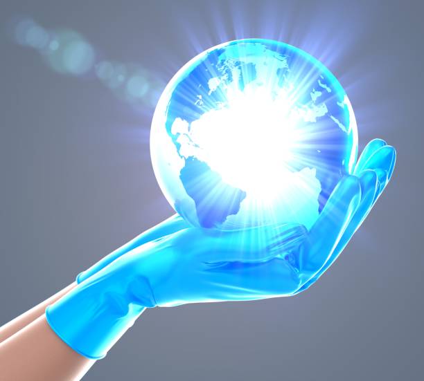 istock Close-up on delicate doctor's hands holding a shiny glass earth 1267284126