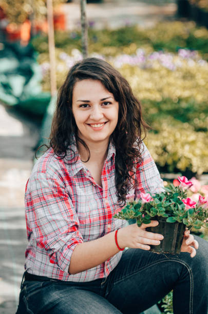 istock florist portrait holding the flowers 1267286576