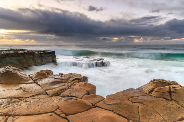 istock Rain Clouds and a Sunrise Seascape 1267286827