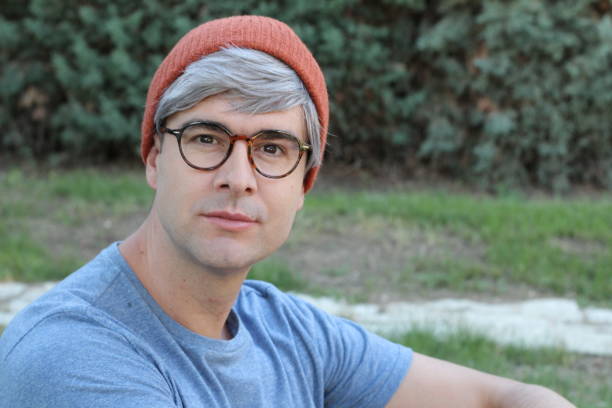 istock Middle aged man wearing eyeglasses and knit hat 1267287993