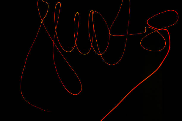 istock Creative conceptual fine art photography motion blur sparkle light trail on dark background copy space for text. Artistic design by lamp fire flame line at night slow shutter speed of camera exposure. 1267288457
