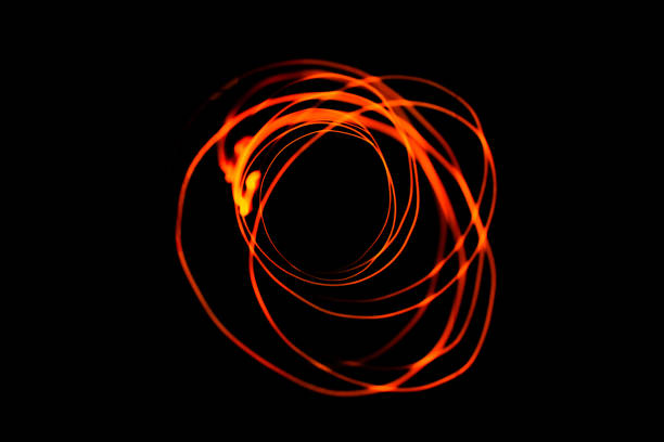 istock Creative conceptual fine art photography motion blur sparkle light trail on dark background copy space for text. Artistic design by lamp fire flame line at night slow shutter speed of camera exposure. 1267288463