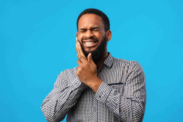 istock Portrait of handsome black guy with tooth ache 1267289515