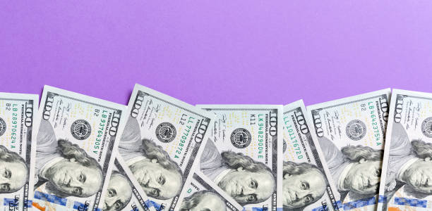 istock one hundred dollar bills Top view of business concept on background with copy space 1267292009