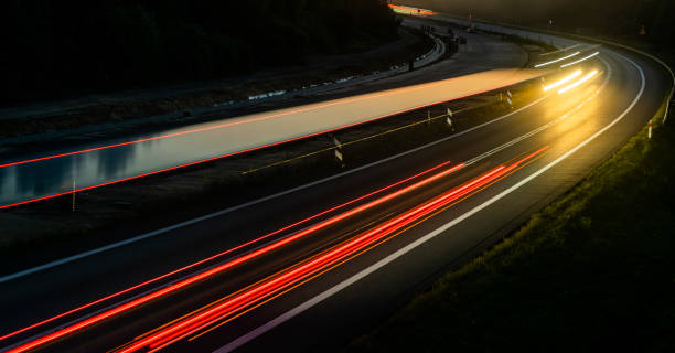 istock lights of cars with night 1267294655