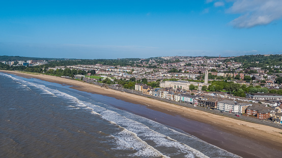 Photo showing sun shining on Swansea Bay and The Guild Hall
