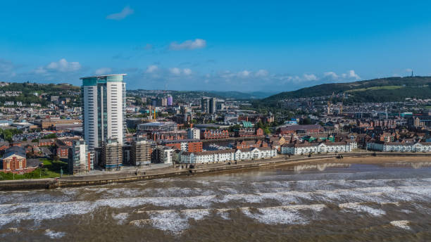 Swansea Bay from the Air Photo showing sun shining on Swansea Bay and The Guild Hall swansea stock pictures, royalty-free photos & images