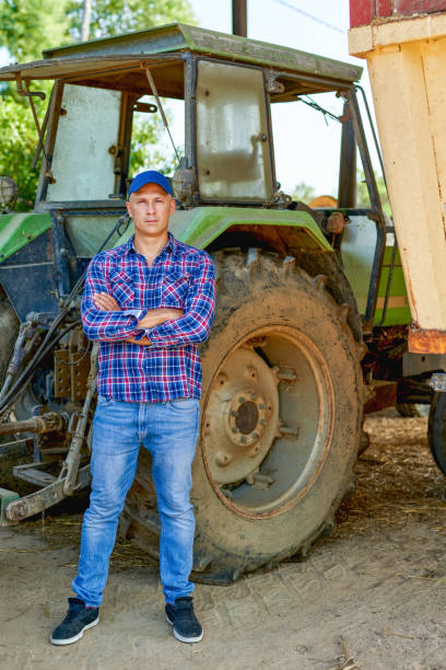 istock farmer driving tractor in countryside 1267296732