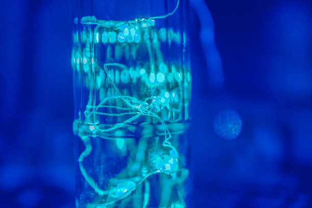 istock Magic blue and cold green light. Green garland in the bottle, abstract. 1267298215