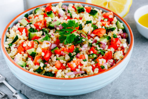 istock Couscous Tabbouleh Salad with fresh tomatoes, cucumbers and red onions 1267299042