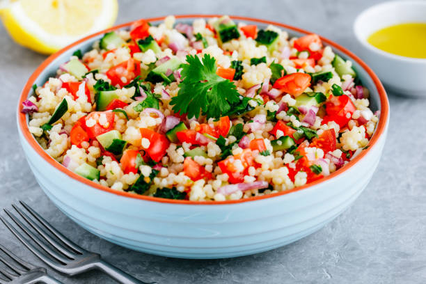 istock Couscous Tabbouleh Salad with fresh tomatoes, cucumbers and red onions 1267299633